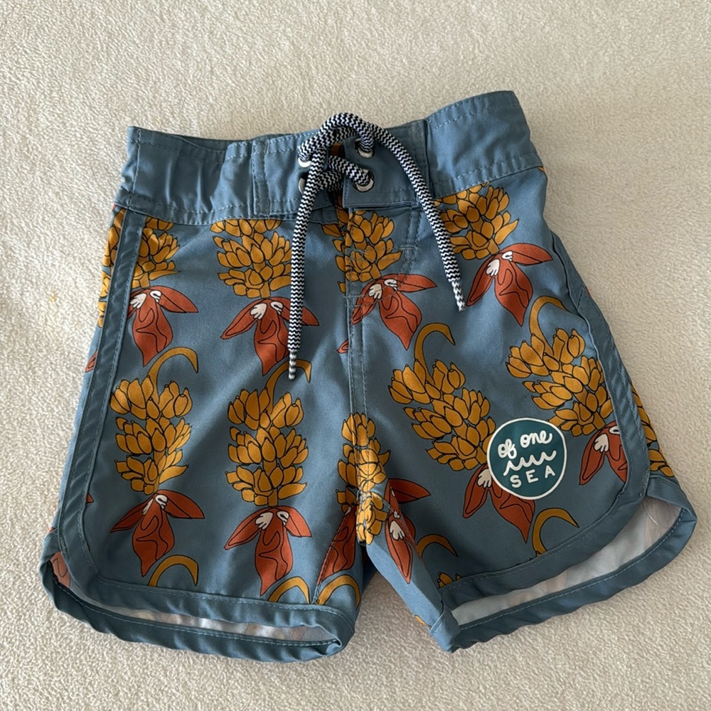 Of One Sea Swim Trunks